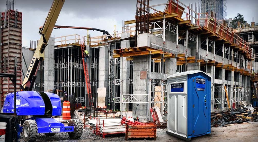 The Blue And White Construction Flush Portable Toilet Near Construction Site