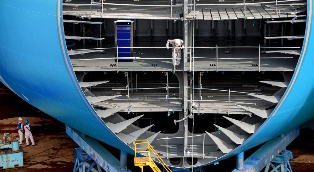 SkyUrinal Portable Urinal | SkyUrinal Portable Urinal at a Drydock with a Ship Under Construction