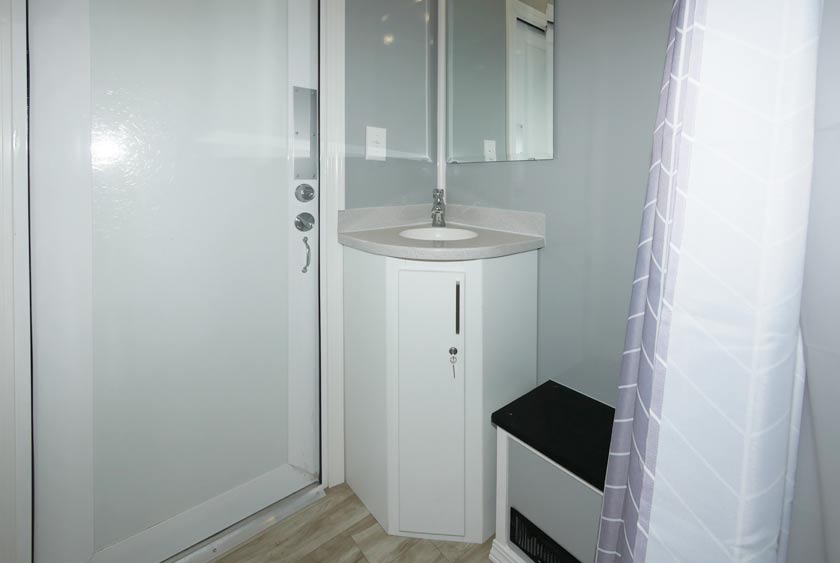 THE FOGHORN SHOWER TRAILER INTERIOR IS SPACIOUS AND COMFORTABLE