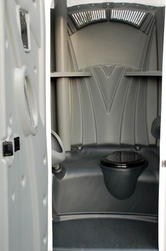 A White Toilet Portable Restroom.