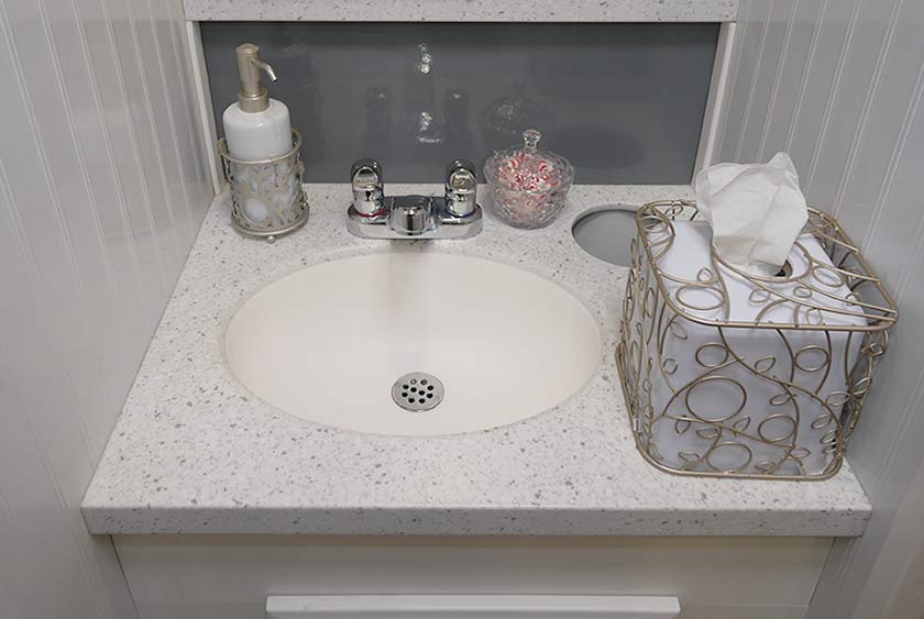PORCELAIN SINK SHOWN WITH ADDITIONAL AMENITIES