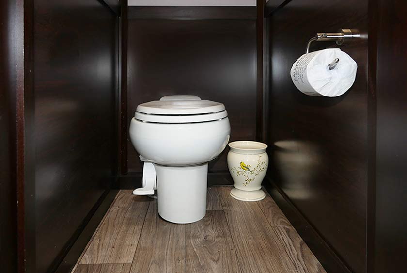 FULL SIZED PORCELAIN TOILETS IN ALL STALLS