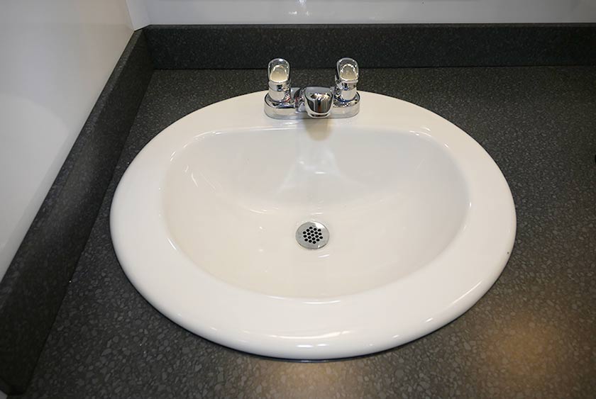 STAINLESS HAND WASHING SINK BASINS PROVIDE HOT AND COLD RUNNING WATER OPTIONS ON THE MAIN FLOOR   