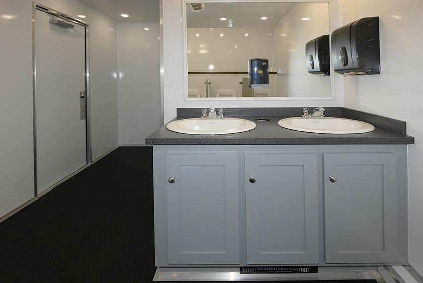 STORAGE AREA BENEATH THE VANITY FOR EXTRA SUPPLIES 