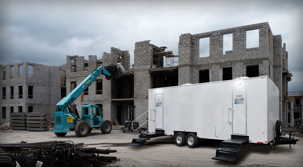 The PLANDOME Restroom Trailer Near A Construction Site