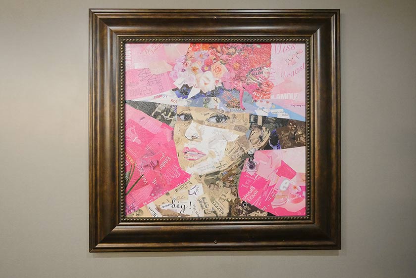 ECLECTIC FRAMED ARTWORK THROUGHOUT COMMON AREAS AND INSIDE BATHROOM STALLS