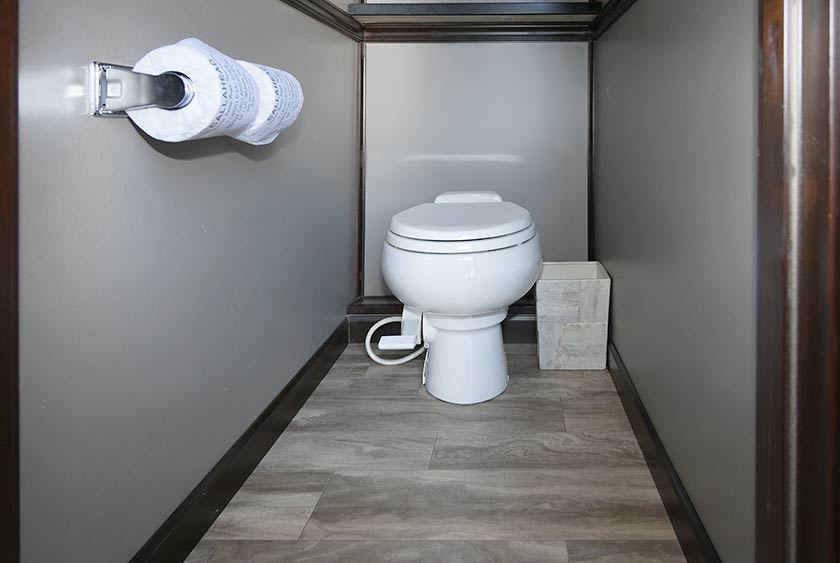 FULL SIZED PORCELAIN TOILETS WITH FOOT-PEDAL FLUSH FOR CONVENIENT HANDS-FREE OPERATION
