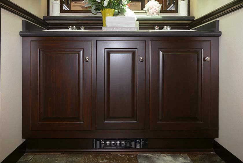 LARGE STORAGE SPACE UNDER VANITIES, PLUS TOE-KICK HEATERS