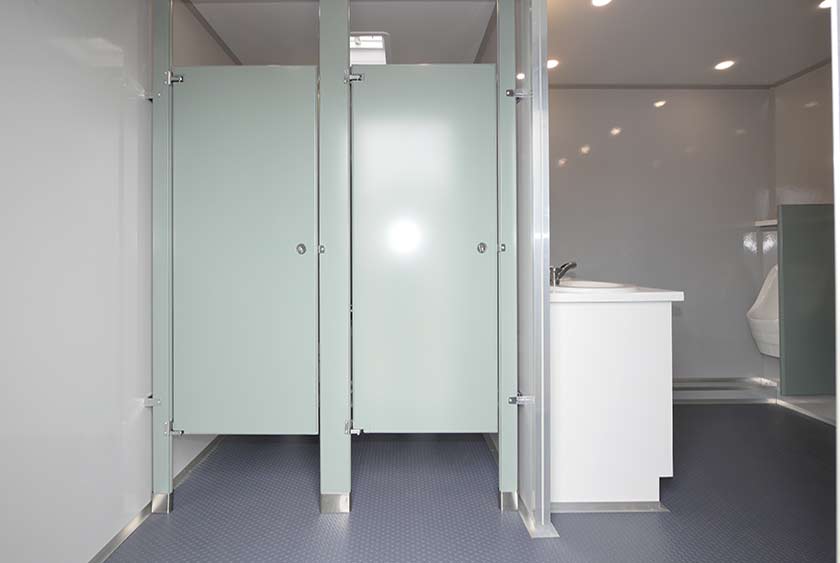 ENTRANCE TO MEN'S RESTROOM IS BRIGHT AND WIDE