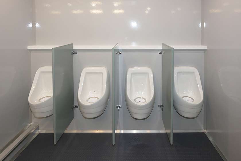 FOUR PORCELAIN ODORLESS URINALS ON MEN'S SIDE