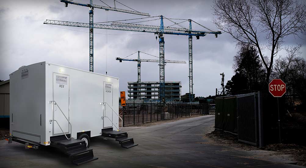 The Construction Restroom Trailer Near Building Site