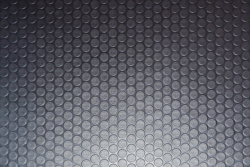 COMMERCIAL GRADE RUBBER COIN FLOORING THROUGHOUT THE BATHROOM TRAILER