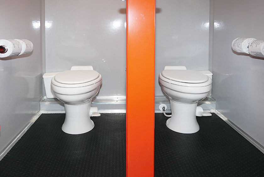 TWO PORCELAIN TOILETS ON WOMEN'S SIDE