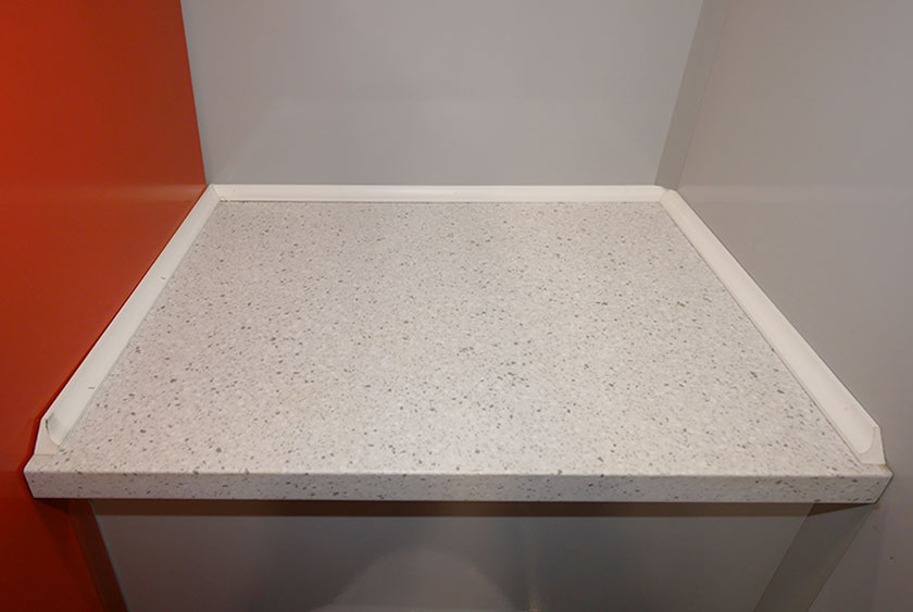 CONVENIENCE SHELF ABOVE MEN'S URINAL