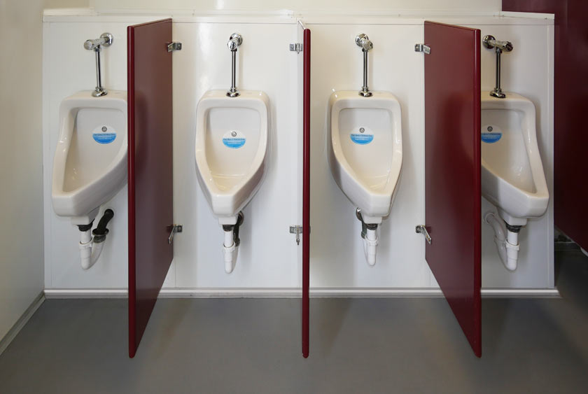 FOUR PORCELAIN URINALS