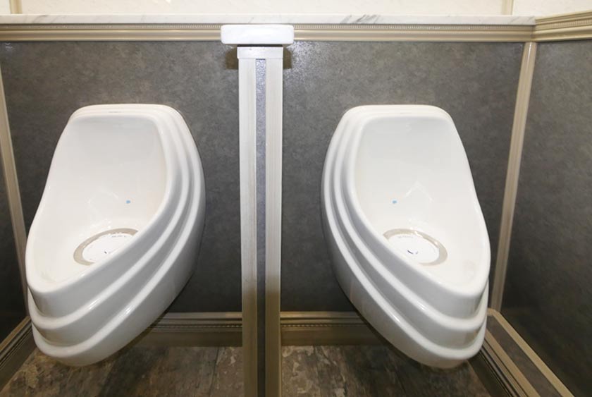 TWO PORCELAIN, ODORLESS URINALS