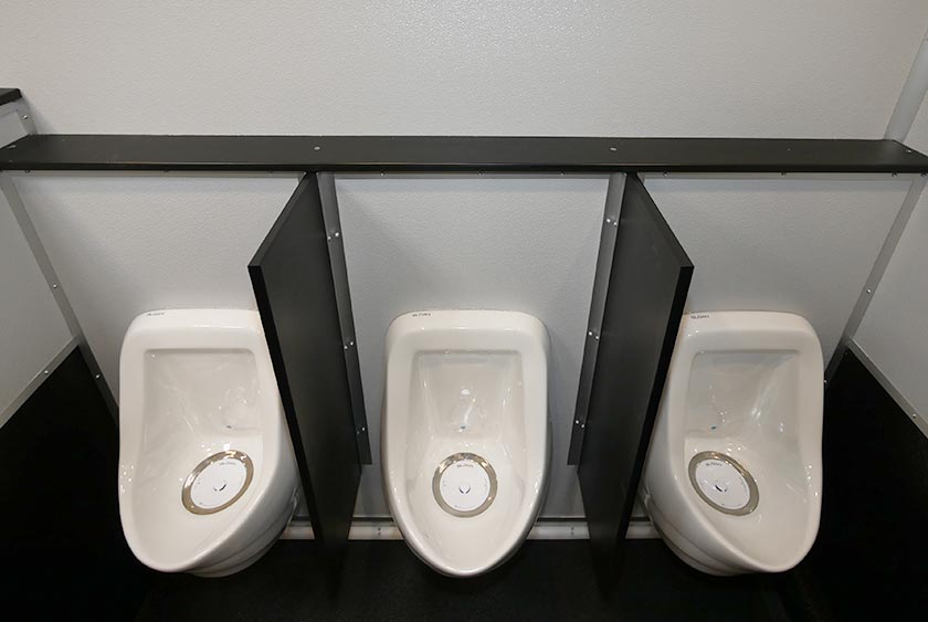 THREE PORCELAIN URINALS FOR MEN