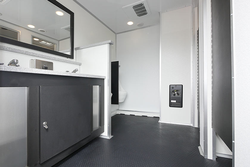 ENTRANCE TO MEN'S SIDE OF THE RESTROOM TRAILER