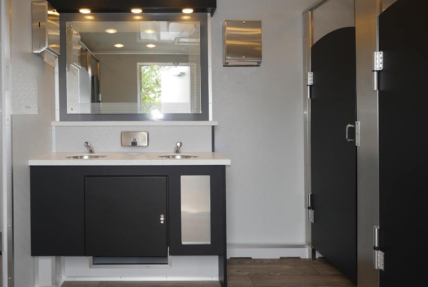 FOYER ON WOMEN'S SIDE WITH SINK VANITY AND MIRROR