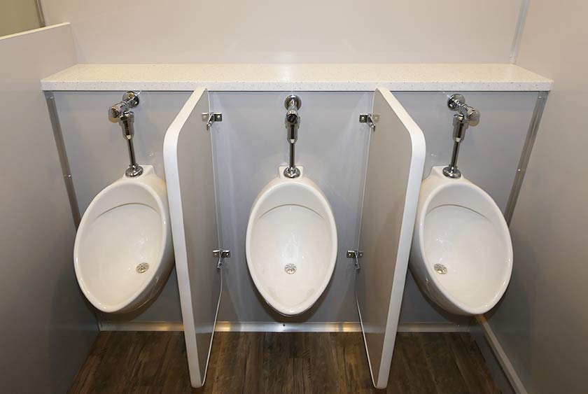 THREE PORCELAIN URINALS WITH AUTOMATIC FLUSH SHUTOFF