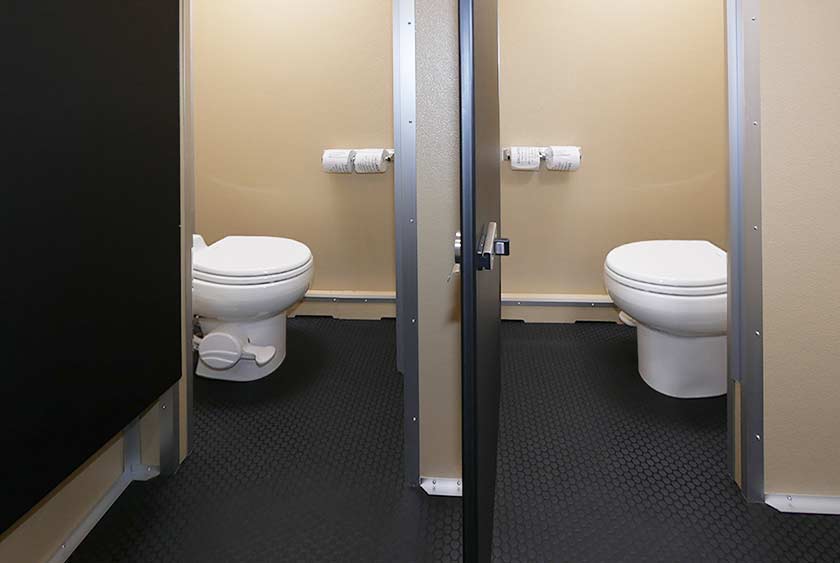 BATHROOM STALLS WITH SOLID LOCKING DOORS