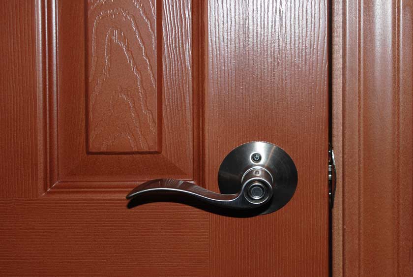STALLS HAVE FLOOR TO CEILING LOCKING DOORS WITH SOLID HARDWARE