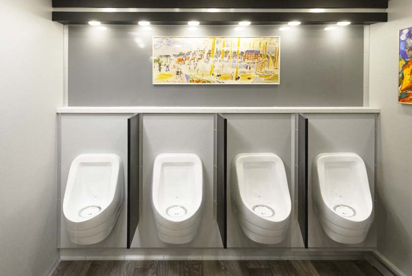 FOUR PORCELAIN WATERLESS URINALS PROVIDE ODORLESS OPERATION