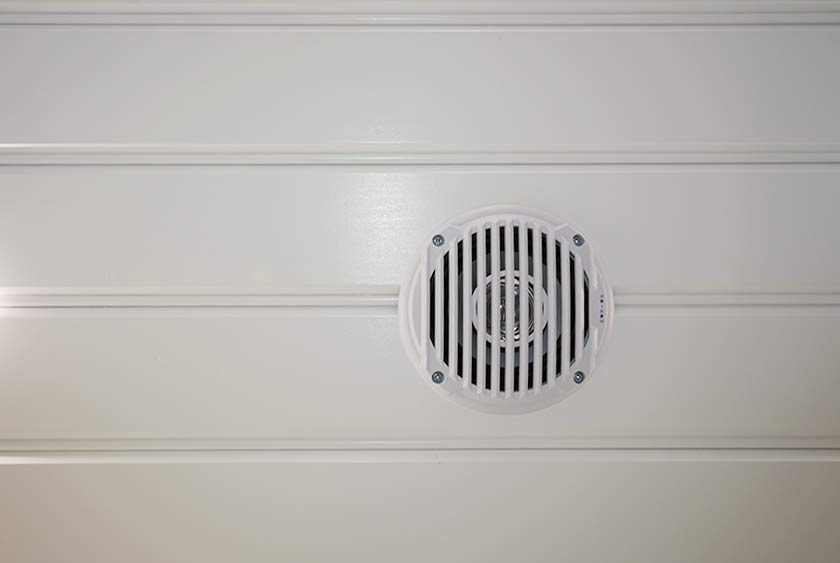 CENTRAL MUSIC SYSTEM WITH AM/FM RADIO AND CD PLAYER AND CEILING SPEAKERS