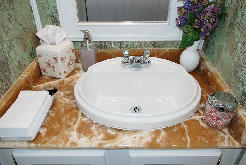 VANITY COUNTER TOPS ARE A RARE BEIGE AND WHITE ONYX MARBLE