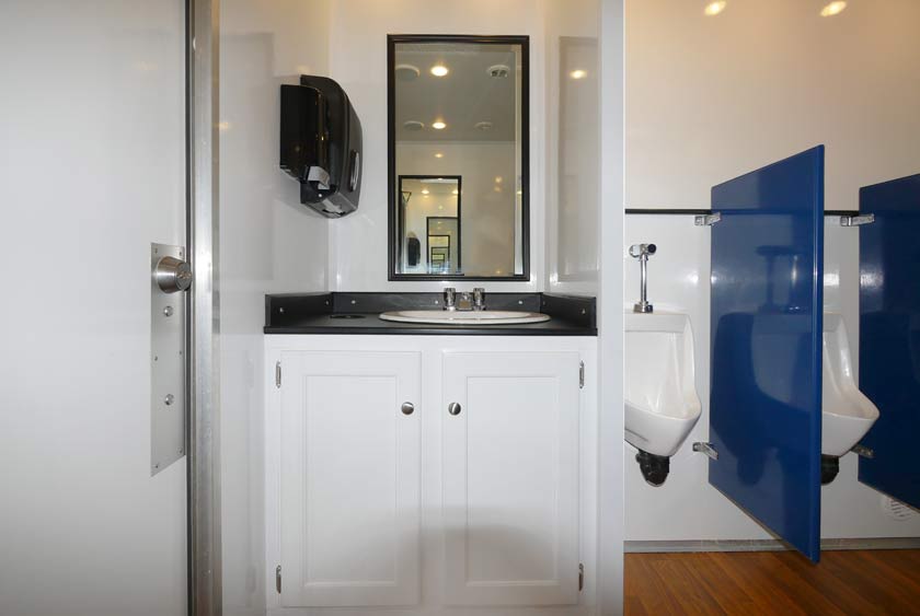 SINK VANITY WITH LARGE MIRROR IN EACH RESTROOM