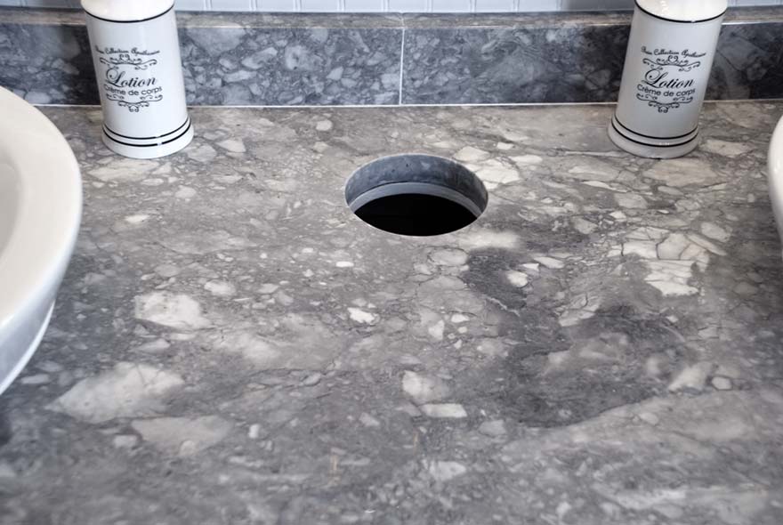 GRANITE COUNTERTOPS WITH TRASH RECEPTACLE CUTOUT