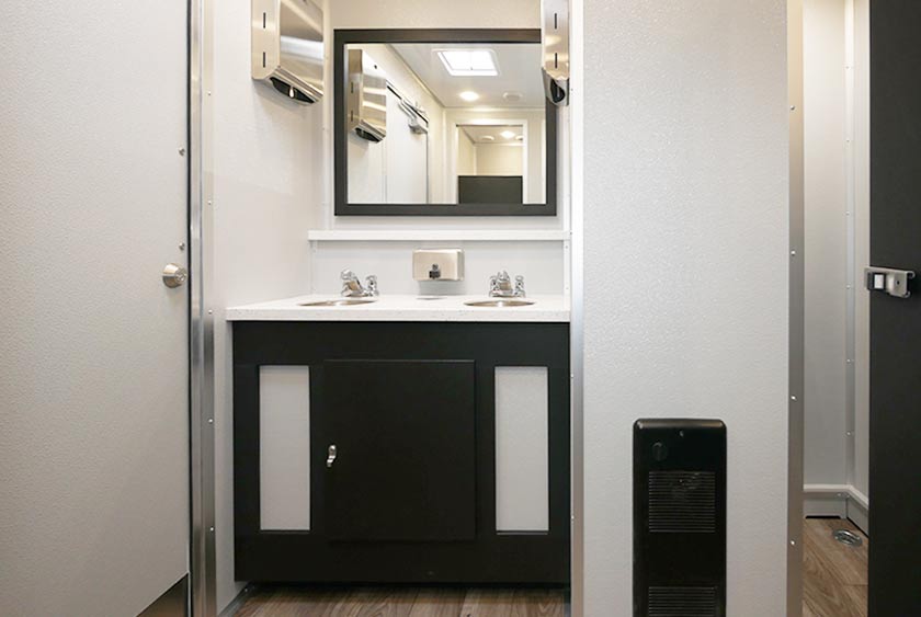 ROOMY FOYER WITH VANITY AND SINKS