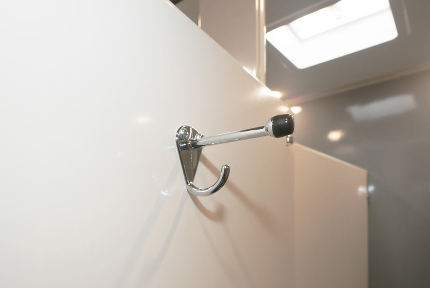 COAT AND HAT HOOKS INSIDE EACH STALL FOR CONVENIENCE