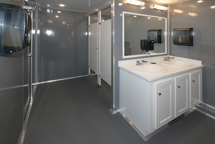 MEN'S SIDE INCLUDES TWO TOLET STALLS, TWO SINKS AND FOUR URINALS