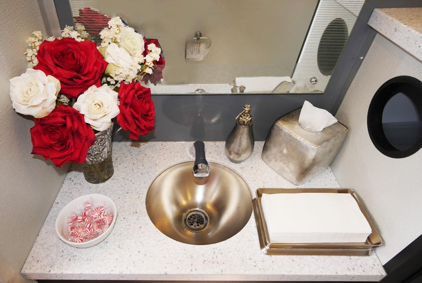 AMENITIES INCLUDE SILK FLOWER ARRANGEMENTS AND FILLED CANDY DISHES