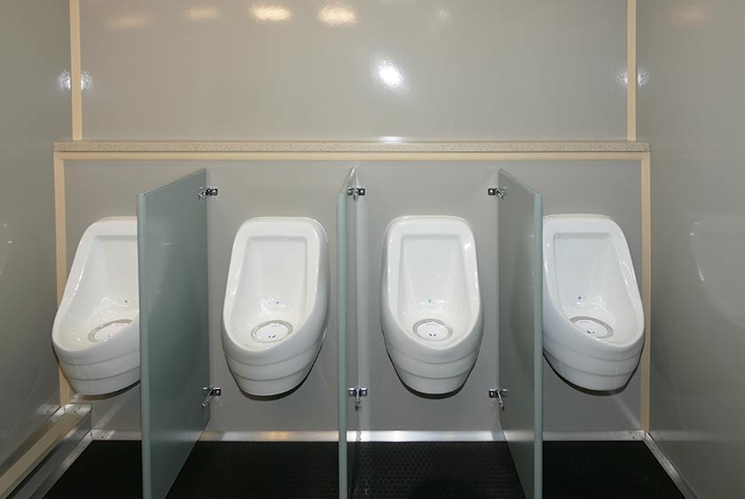 FOUR SLOAN PORCELAIN URINALS