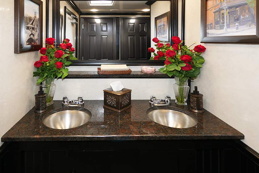BEAUTIFULLY APPOINTED VANITY WITH DUAL SINKS AND LARGE MIRROR 
