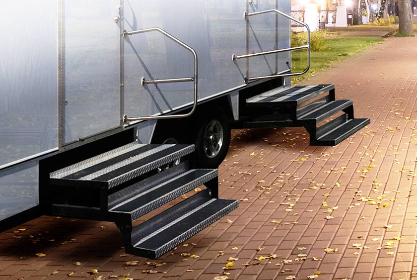 STURDY STAIRCASES WITH HANDRAILS ON THE WHITE HORSE RESTROOM TRAILER
