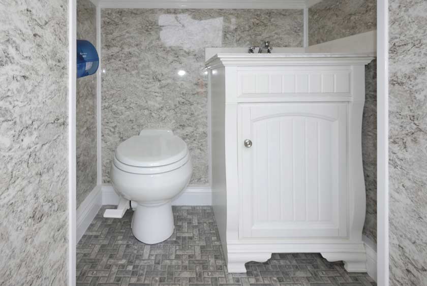 PEDAL FLUSH TOILET AND WHITE WOOD VANITY
