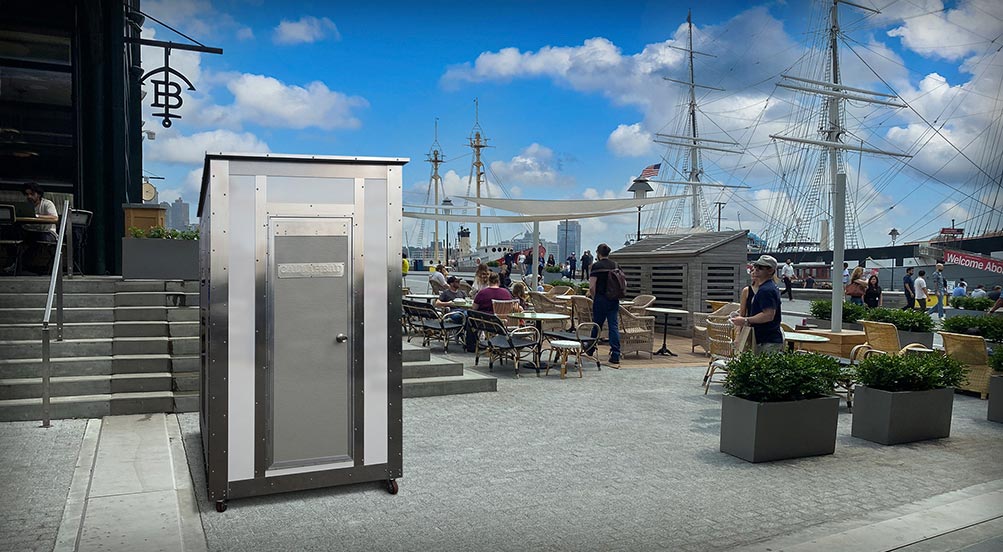 White Wash Portable Restroom | The White Wash Portable Restroom at a High Rise Building Construction Site.
