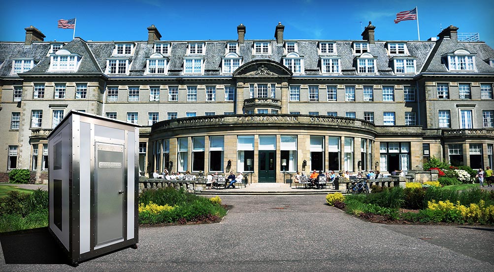White Wash Portable Restroom | Grey White Wash Portable Restroom Outside of a Construction Tunnel with Freight Car