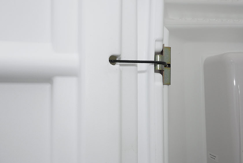 SPRING LOADED DOOR CLOSES AUTOMATICALLY